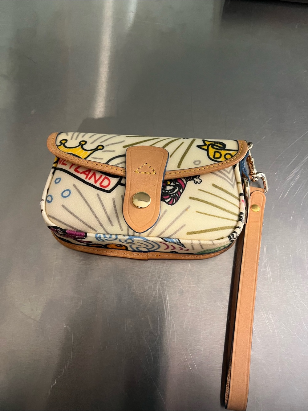 Dooney & Bourke Cream Printed Disney Wristlet with Tan Leather Trim